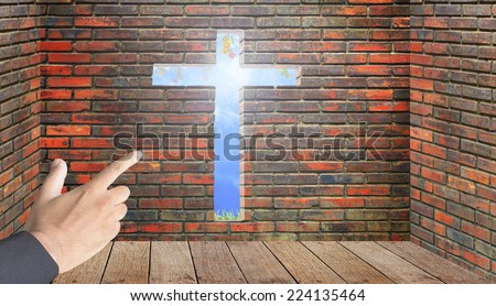 Jesus is light for way of life and give fruitful. Human hand pointing cross channel on room by clay brick wall with wooden floor and brightness fruitful garden with blue sky.