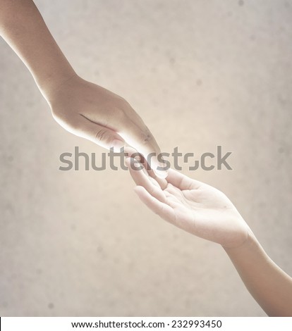 Hand of a man reaching to hand of GOD.