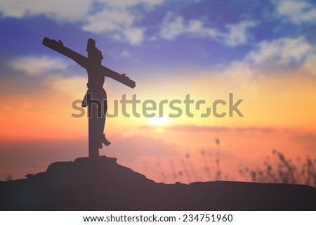 Silhouette Jesus and the cross over blurred sunset background. Christmas background, Worship, Forgiveness, Mercy, Humble, Repentance, Reconcile, Adoration, Glorify, Peace concept.