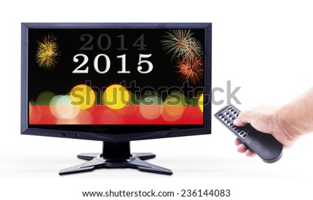 2014-2015 change represents the new year 2015. Human hand holding remote and monitor display 2014-2015 change with firework and bokeh isolated on white.