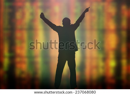 Silhouette businessman raising hands with pen and phone over blurred lot board background.