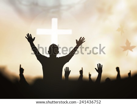 Sepia tone, silhouette people raising hands over blurred crown of thorns and the cross on nature background.