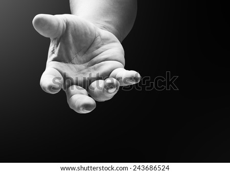 Black and white human hand open empty hands with palms up, gesture of asking for the help or reach for helping someone who is troubled. Pray for support concept. Established principle concept.