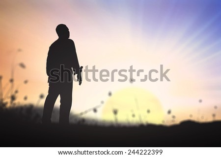 Silhouette human standing over blurred nature background.