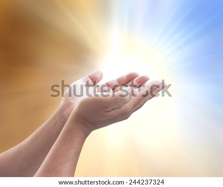 Human open empty hands with palms up, over blurred nature background. World Mental Health Day concept.