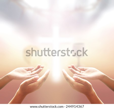 Two people open empty hands with palms up, over blurred crown of thorns and the cross with glass of wine and Loaf of bread in eucharist of christian.