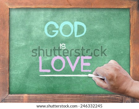 Human hand holding chalk and writing text form bible \
