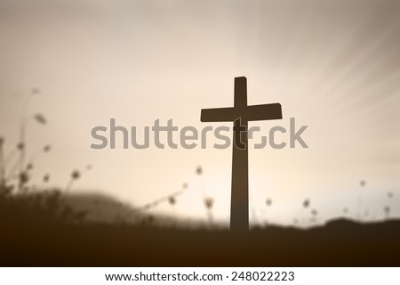 Silhouette the cross over over blurred beautiful sunset with amazing light background. Christmas Forgiveness Mercy Humble Evangelical Reconcile Adoration Glorify Redeemer Religion Hallelujah concept.