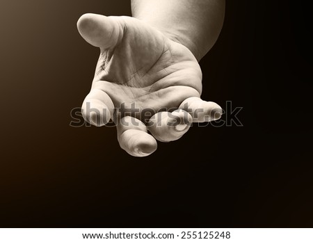 Sepia tone, human open empty hand with palms up.