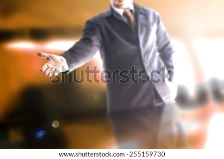 A business man with an open hand ready to seal a deal.