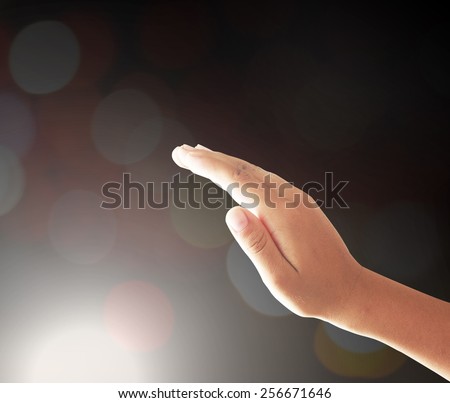 Human hand praying to other people over night light background. Christmas background, Evangelical, Mercy, Humble, Repentance, Hallelujah, Surrender, Holy Spirit, Thanksgiving, Blessing concept