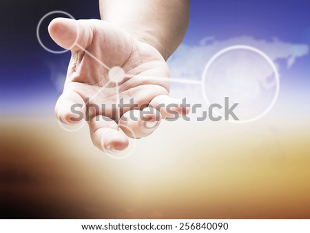 Human hand working with blank flow chart over blurred world map of clouds background.