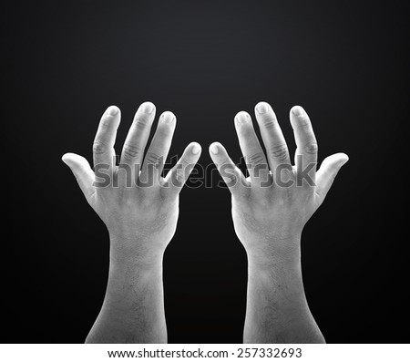 Black and white human open empty hands with palms up.