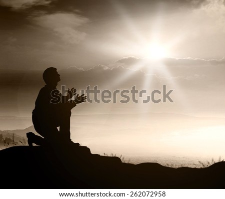 Sepia tone. People kneeling and praying over sunset. World Mental Health Day concept.