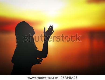 Silhouette of woman praying. Surrender, Worship, Forgiveness, Mercy, Humble, Repentance, Reconcile, Adoration, Glorify, Redeemer, Redemption, Pray, Praise, Way Of Life, Trust, Love concept.
