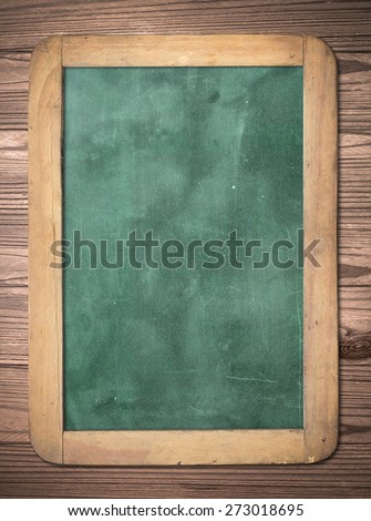 Grunge blank old wood green board or dirty slate board on wood background. Food Menu, List, Calendar, Classroom, Training, Remind, Drawing, Preaching, Teacher Day concept