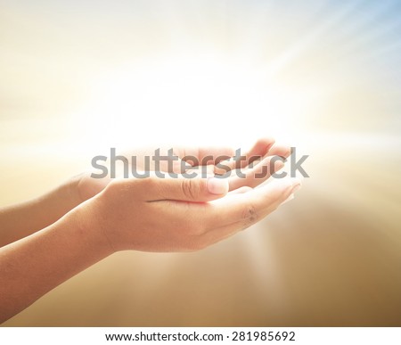 Children open empty hands with palms up over blurred beautiful bokeh light of sunset background. Vintage style. Pray for support concept.