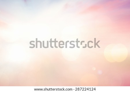 Vintage style. Blurred sunrise over city background with circle light. Abstract blurred nature textured background: pink yellow blue patterns.