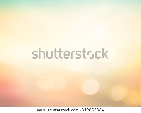 Abstract blurred sunrise over city background with circle bokeh light. Beautiful light of hope from heaven concept. Orange yellow and green colors patterns. Blur backgrounds concept.