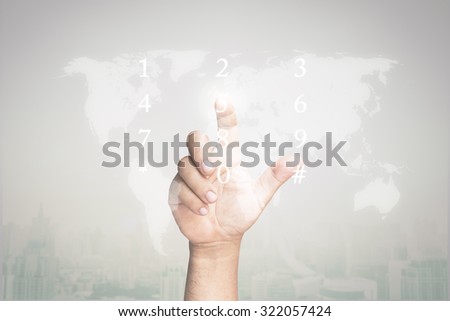 Human hand touching on number and world map with futuristic communication interface on blurred the city. Elements of this image are furnished by NASA.