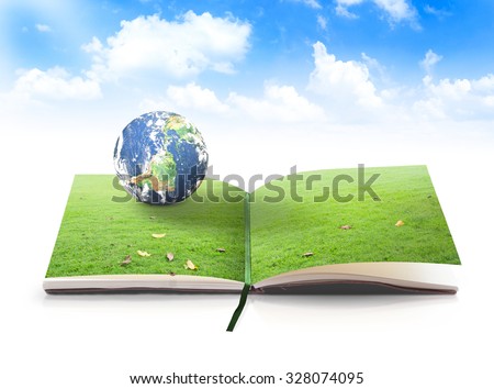 Open book in planet rest on beautiful green meadow over blue sky background. Environment concept. Elements of this image furnished by NASA.