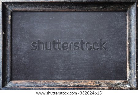 Grunge blank old wood blackboard or dirty slate board.