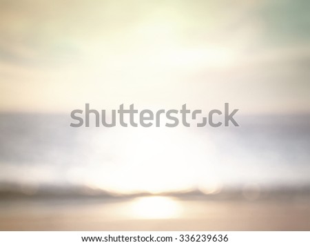 Vintage style. Abstract blurred textured background: yellow orange green patterns. Sandy beach backdrop with turquoise water and bright sun light. Summer holidays concept.
