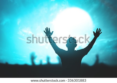 Silhouette people raising hands over blur blue light night sky background. Responsibility, Worship, Forgiveness, Mercy, Humble, Repentance, Reconcile concept.