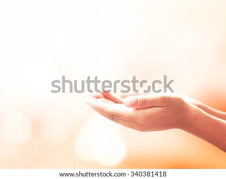 Two open empty hands & palms up, on amazing light background. Pray for support concept. Business, Environment Day, Baptism of the Jesus, World Mental Health, Dignity, thanksgiving, Candlemas concept.