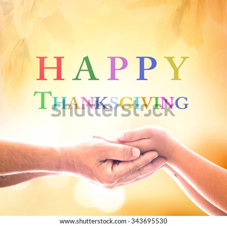 Two human hands holding Fruitful text for HAPPY THANKSGIVING over blurred beautiful nature background. Thank You God concept.