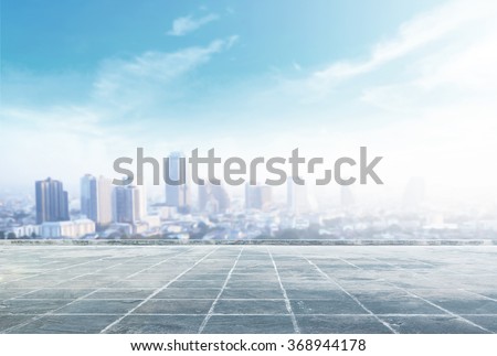 Empty square and floor with blurred aerial view of Bangkok skyline on amazing beauty sunlight. Beautiful hotel, resident of Bangkok, Thailand, Asia. Abstract blur big city background concept.