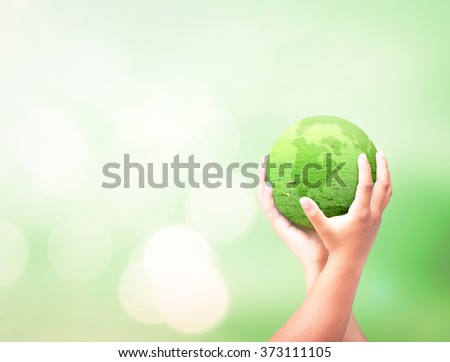 Human hand hold globe grass on beautiful nature background. Environment Rights Day World Religion Cancer CSR Go Green Earth Hour Trust Love Thanking Learning Health Care Charity Life Unity concept