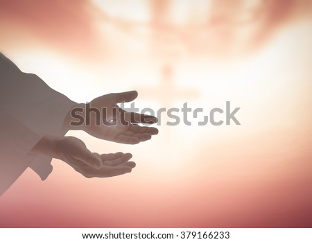 Silhouette the hands of Jesus Christ opening palm up and showing scars on blurred the cross with crown of thorns background. Resurrection Humble Eucharist Blessed Christian Give Nail Religion concept.