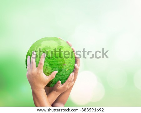 Many Human hand holding globe grass on beautiful nature background. Investment Synergies Ecology World Environment Day CSR Mission Ecosystem Go Green Trust Harmonious Zero Discrimination concept.