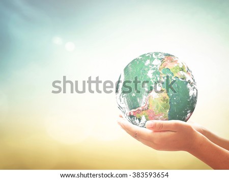 Planet in human hands. Ecology World Environment Day Investment CSR Earth Hour Peace Health Care Eco Friendly Trust Give Offer Help Life Energy Search concept. Elements of this image furnished by NASA