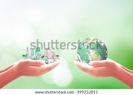 Two human hand hold big city and planet. Quality Finance Learning CSR Unity Trust Water Sea ROI Idea Team Global Forest Synergy Teamwork Charity Save concept. Elements of this image furnished by NASA.