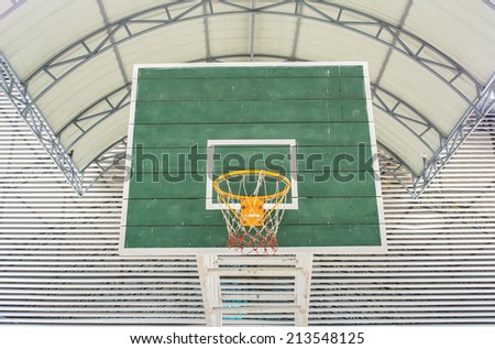 yellow Basketball hoop and green wooden panel