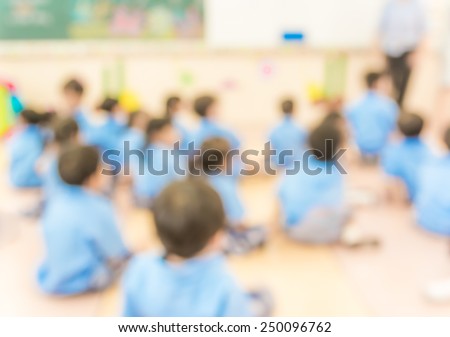 blur classroom  with teacher and kids in uniform