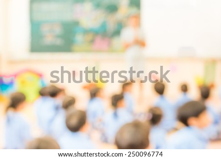 blur classroom  with teacher and kids in uniform