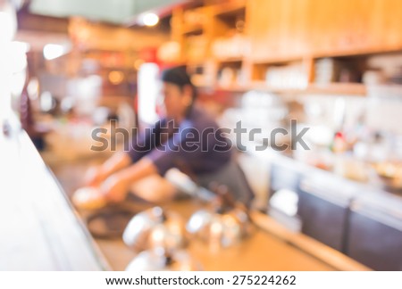 blur image of Japanese chef making food in kitchen for background usage