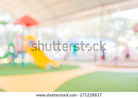Defocused and blur image of children's playground at public park for background usage .