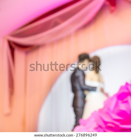 blur image of Thai wedding on purple stage for background usage.