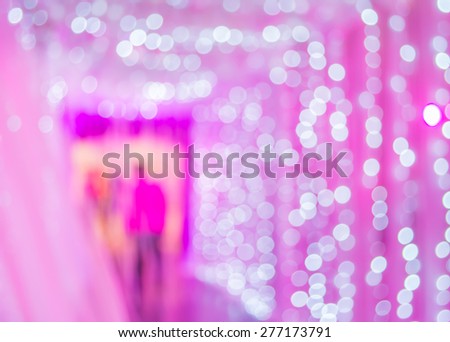 Blurred motion image of people moving to the lights gate indoor