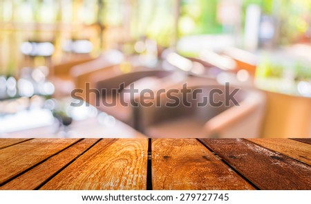 image of  Perspective wood and blurred coffee shop with bokeh light background. product display template.