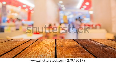 image of  Perspective wood and blurred coffee shop with bokeh light background. product display template