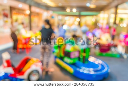 Arcade game machine shop blur background with bokeh image .