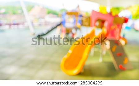 Defocused and blur image of children\'s playground at public park for background usage .