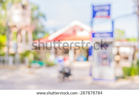 blur image of automatic teller machine on day time .