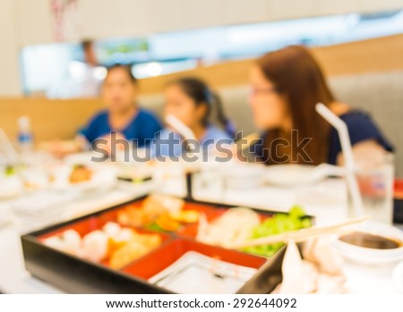 image of blur people at japanese restaurant .