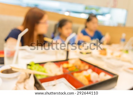 image of blur people at japanese restaurant .